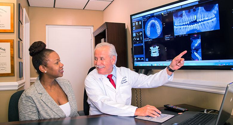 Dr. Levine showing patient x-rays