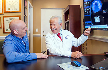Dr Levine showing patient x-rays