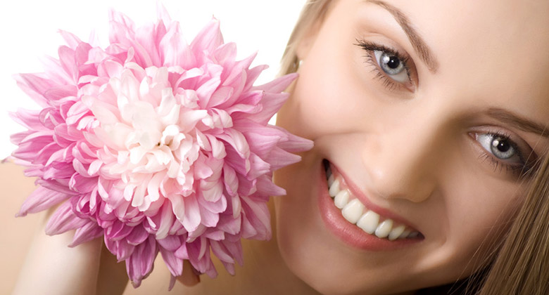 beautiful smile woman with flower isolated